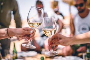 A group of friends drinking wine to celebrate an event.