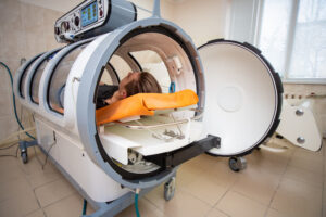 person using hyberbaric chamber for medical treatment
