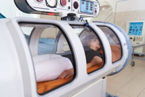 woman in hyperbaric oxygen chamber